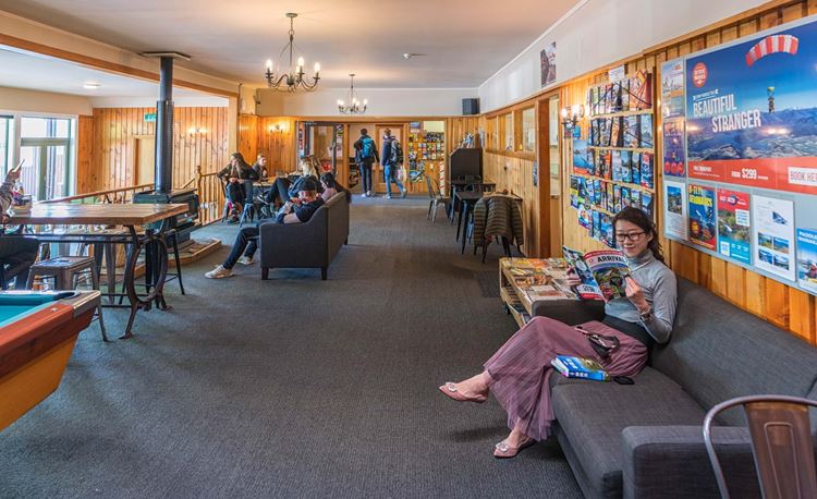 Guests chill in YHA Wanaka's lounge
