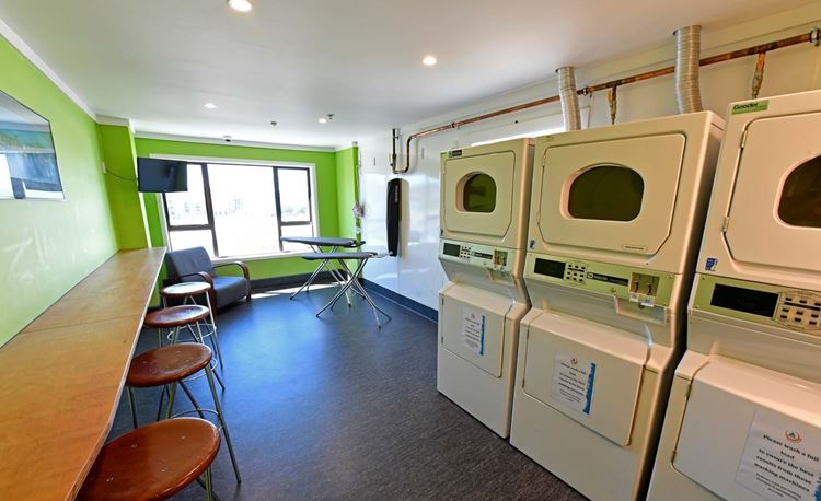 YHA Wellington laundry room with bar stool setup