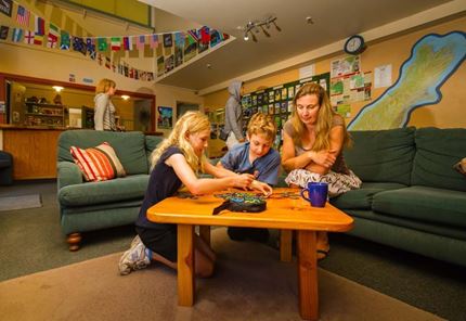 YHA Hanmer Springs family playing in lounge area