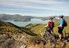 yha christchurch cyclist couple looking over lyttleton in the port hills