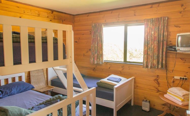 YHA Waitomo family room with double bed and bunks