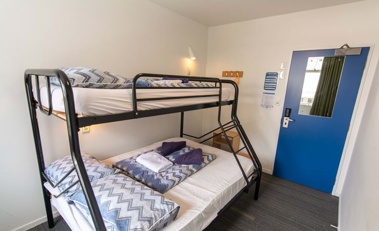 Small family with with double plus single bunk at YHA Auckland International