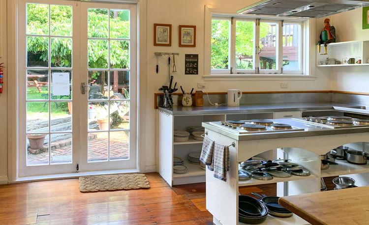 Fully equipped, shared kitchen with outdoor access at YHA Picton, The Villa