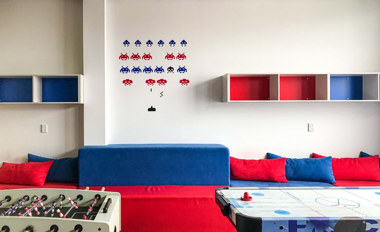 Blue and Red lounge at YHA Nelson with foosball and air hockey games for backpackers and families. 