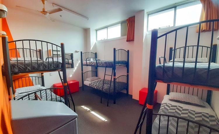 Six bed backpacker dorm accommodation with bunk beds at YHA Nelson. 