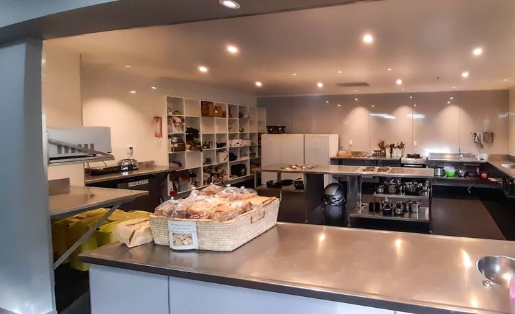 Large fully-equipped shared kitchen at YHA Nelson with storage and cooking facilities. 
